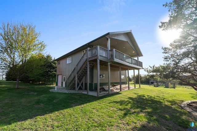 48190 265th St, Brandon, SD 57005 - rear view of property featuring a deck, stairway, and a lawn