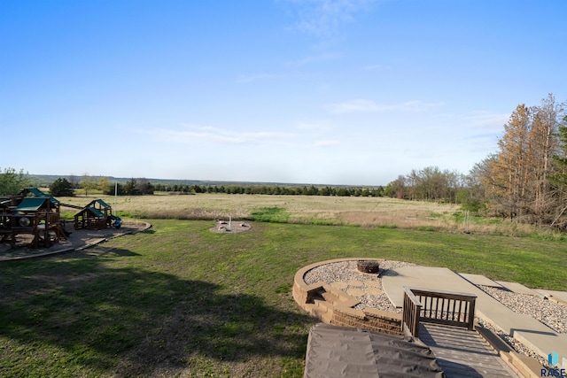 48190 265th St, Brandon, SD 57005 - view of green lawn with an outdoor fire pit, a rural view, and a playground