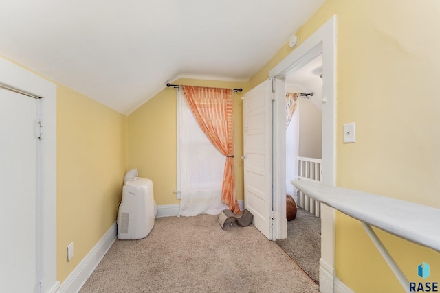 805 S Spring Ave, Sioux Falls, SD 57104 - additional living space featuring vaulted ceiling, carpet, and baseboards