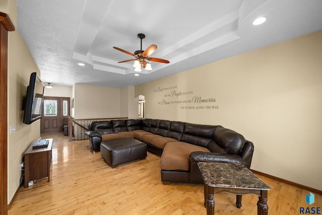 2305 N Ivy Rd, Tea, SD 57064 - living area with a tray ceiling, light wood-style flooring, ceiling fan, recessed lighting, and baseboards