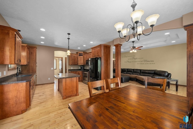 2305 N Ivy Rd, Tea, SD 57064 - dining space with a ceiling fan, light wood-type flooring, baseboards, a chandelier, and recessed lighting