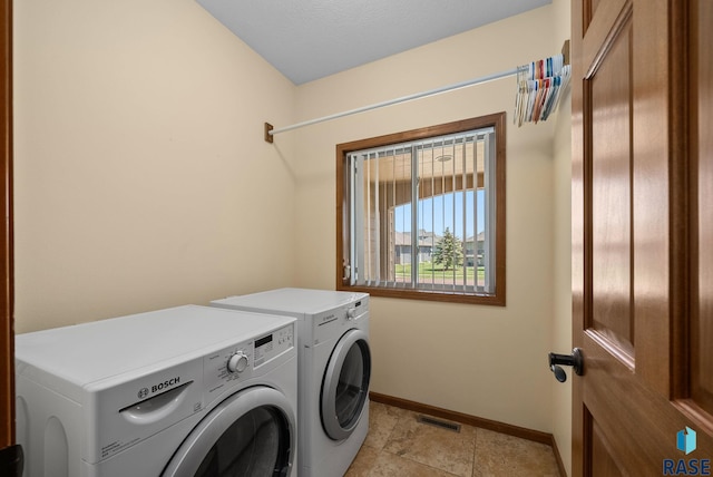 2305 N Ivy Rd, Tea, SD 57064 - laundry room featuring washer and dryer and baseboards