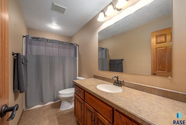2305 N Ivy Rd, Tea, SD 57064 - bathroom with toilet, tile patterned floors, a textured ceiling, vanity, and a shower with shower curtain