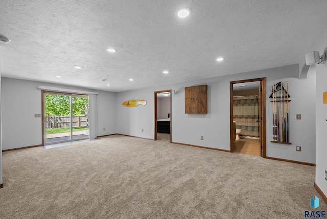 2305 N Ivy Rd, Tea, SD 57064 - spare room with carpet floors, baseboards, a textured ceiling, and recessed lighting