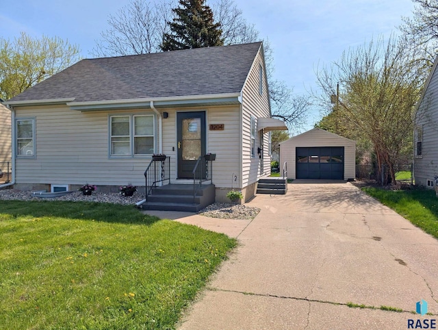 3204 S Phillips Ave, Sioux Falls, SD 57105 - view of front of property featuring an outdoor structure, a garage, a front lawn, and a shingled roof