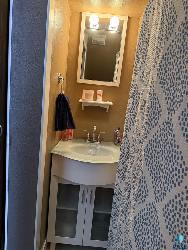 bathroom with a textured wall