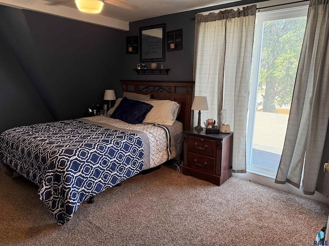 carpeted bedroom featuring access to outside