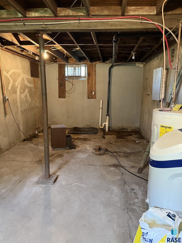 below grade area featuring water heater