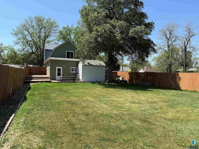 view of yard with a wooden deck