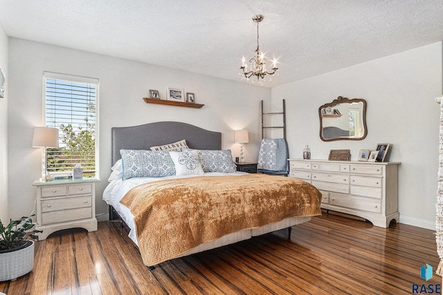 46370 237th St, Wentworth, SD 57075 - bedroom featuring a chandelier, wood-type flooring, and baseboards