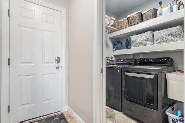 46370 237th St, Wentworth, SD 57075 - washroom with washing machine and dryer and baseboards