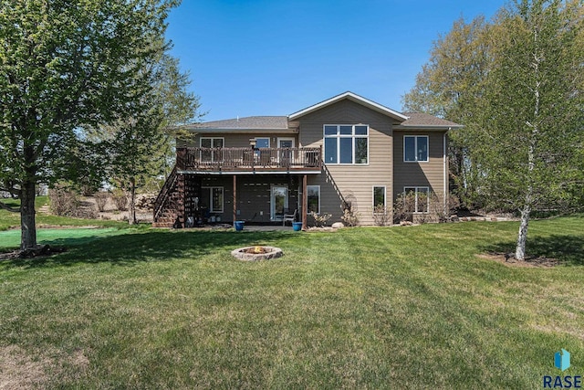 46370 237th St, Wentworth, SD 57075 - back of house with a wooden deck, a fire pit, a yard, and stairway