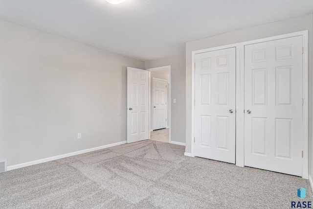 46370 237th St, Wentworth, SD 57075 - unfurnished bedroom with carpet, baseboards, and a closet