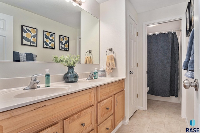 46370 237th St, Wentworth, SD 57075 - full bath with double vanity, tile patterned flooring, and toilet