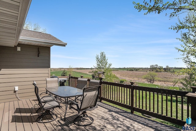 46370 237th St, Wentworth, SD 57075 - wooden terrace featuring outdoor dining space, a view of countryside, and a lawn