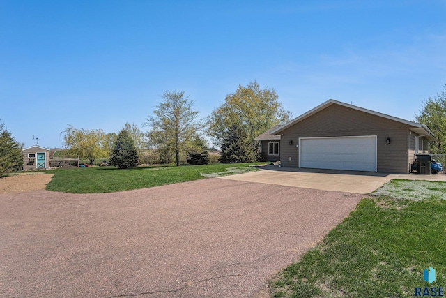 46370 237th St, Wentworth, SD 57075 - ranch-style home featuring driveway, a front lawn, and a garage