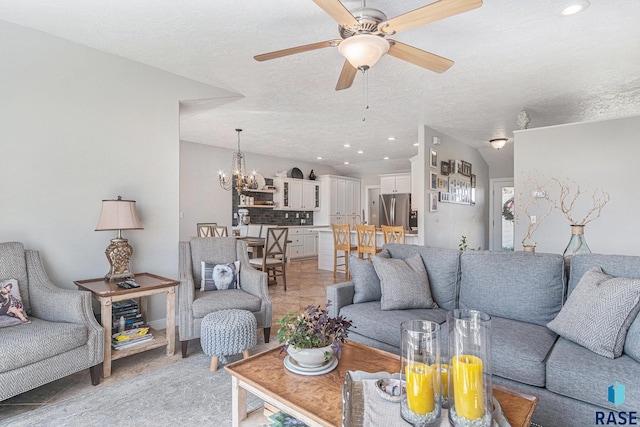 46370 237th St, Wentworth, SD 57075 - living area with ceiling fan, a chandelier, and a textured ceiling