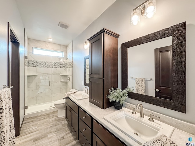 8612 W Dalton St, Sioux Falls, SD 57106 - full bath with toilet, a stall shower, double vanity, and wood finished floors