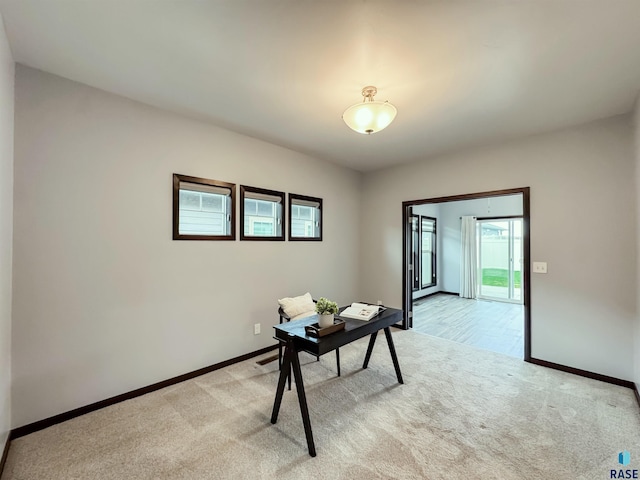 8612 W Dalton St, Sioux Falls, SD 57106 - home office featuring light carpet and baseboards
