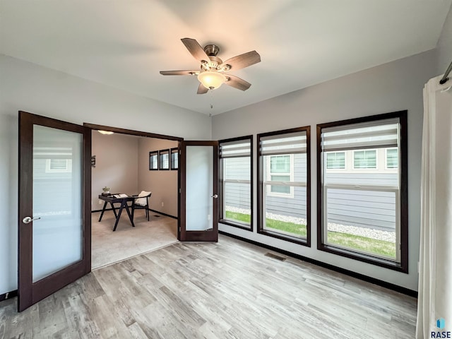 8612 W Dalton St, Sioux Falls, SD 57106 - spare room featuring light wood-style floors, healthy amount of natural light, and ceiling fan
