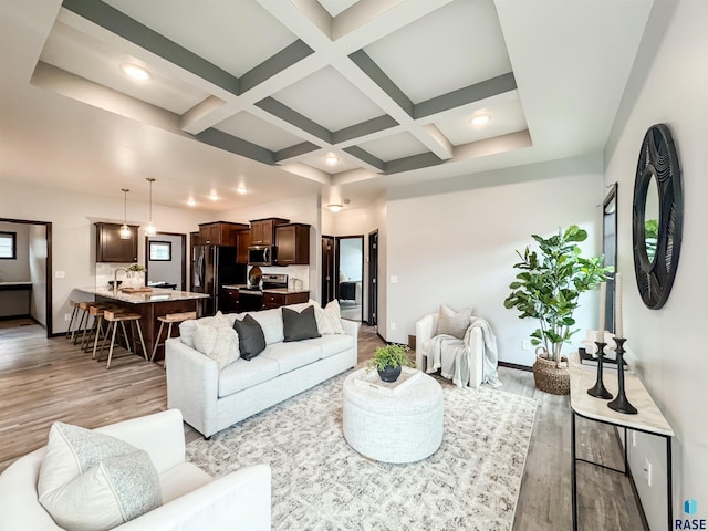 8612 W Dalton St, Sioux Falls, SD 57106 - living room with light wood-type flooring, coffered ceiling, beamed ceiling, baseboards, and recessed lighting