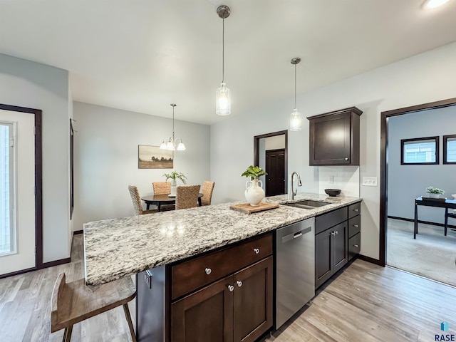 8612 W Dalton St, Sioux Falls, SD 57106 - kitchen with a sink, dishwasher, a peninsula, light wood-style flooring, and dark brown cabinetry