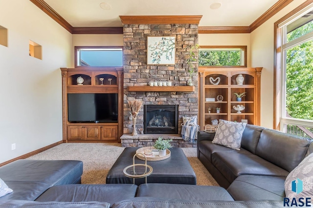 carpeted living area featuring crown molding, plenty of natural light, baseboards, and a fireplace