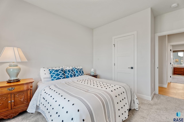 bedroom featuring baseboards and carpet floors