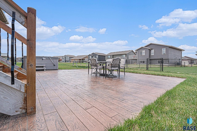 2629 S Richie Dr, Sioux Falls, SD 57106 - view of patio featuring a residential view, a wooden deck, and outdoor dining space
