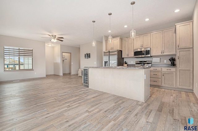 2629 S Richie Dr, Sioux Falls, SD 57106 - kitchen featuring appliances with stainless steel finishes, light wood-style flooring, a ceiling fan, pendant lighting, and recessed lighting