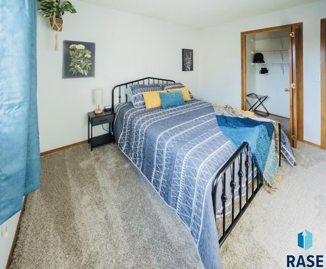 2304 S Mockingbird Cir, Sioux Falls, SD 57103 - bedroom with carpet flooring and baseboards