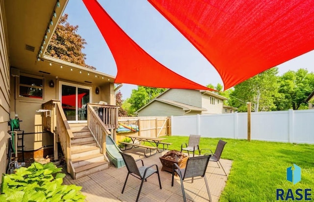 2304 S Mockingbird Cir, Sioux Falls, SD 57103 - view of patio / terrace featuring a fire pit and a deck
