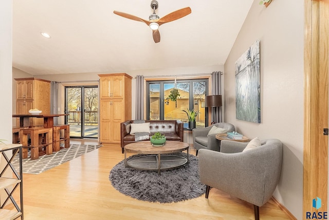 408 N Oak Ridge Rd, Brandon, SD 57005 - living area featuring lofted ceiling, ceiling fan, light wood finished floors, and healthy amount of natural light
