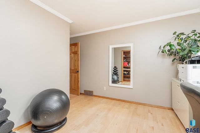 408 N Oak Ridge Rd, Brandon, SD 57005 - workout room featuring light wood-style floors, crown molding, and baseboards
