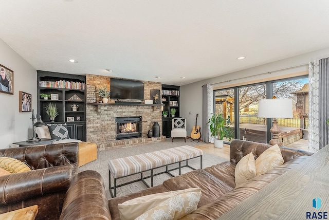 408 N Oak Ridge Rd, Brandon, SD 57005 - living area with a brick fireplace, recessed lighting, built in shelves, and wood finished floors