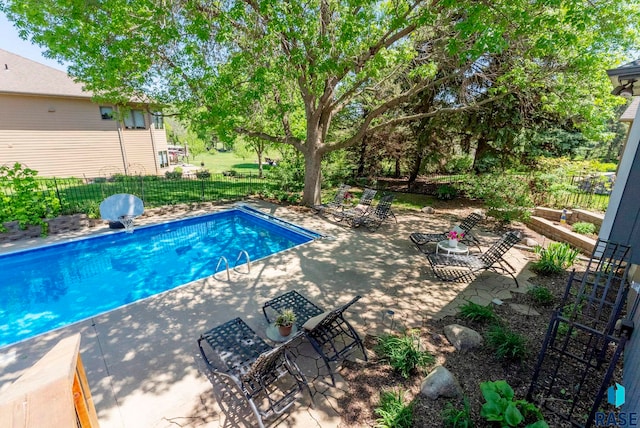 408 N Oak Ridge Rd, Brandon, SD 57005 - view of swimming pool featuring a patio area and a fenced backyard