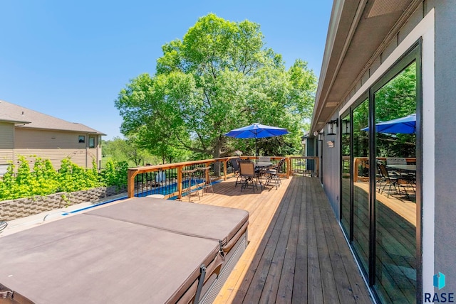 408 N Oak Ridge Rd, Brandon, SD 57005 - wooden deck featuring outdoor dining area and a hot tub
