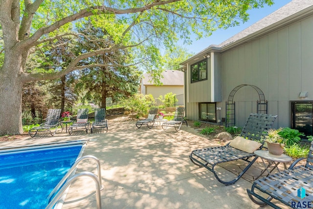 408 N Oak Ridge Rd, Brandon, SD 57005 - swimming pool featuring a patio area and fence