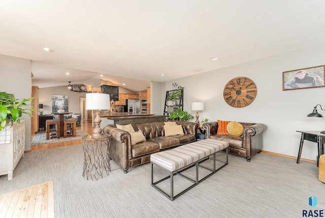 408 N Oak Ridge Rd, Brandon, SD 57005 - living area featuring vaulted ceiling, baseboards, light colored carpet, and recessed lighting