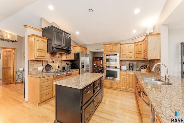 408 N Oak Ridge Rd, Brandon, SD 57005 - kitchen featuring a sink, appliances with stainless steel finishes, vaulted ceiling, light stone counters, and light wood-style floors