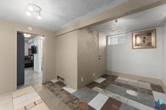 basement featuring baseboards