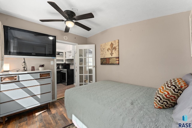 bedroom with dark wood-style flooring, ceiling fan, and vaulted ceiling
