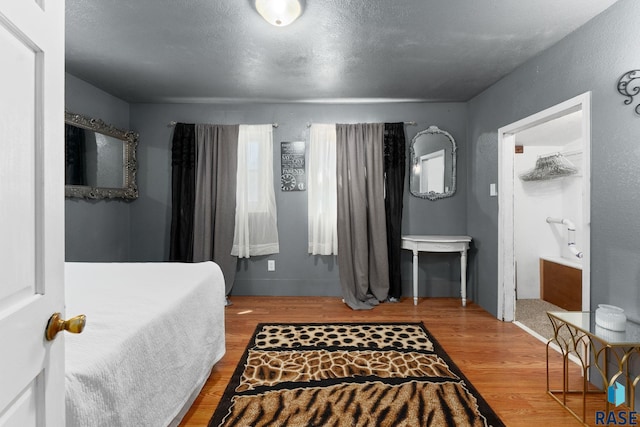 bedroom with wood finished floors