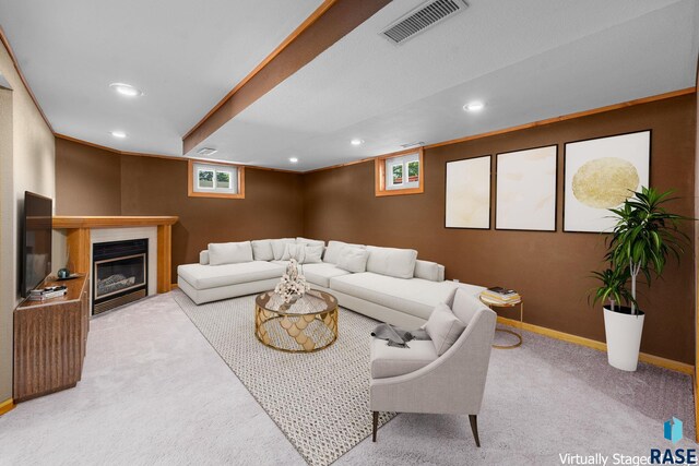 1712 S Bruce Rd, Sioux Falls, SD 57105 - living area featuring carpet, recessed lighting, plenty of natural light, a glass covered fireplace, and baseboards