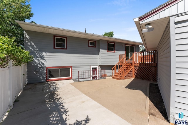 1712 S Bruce Rd, Sioux Falls, SD 57105 - back of house featuring a patio, a deck, and stairway