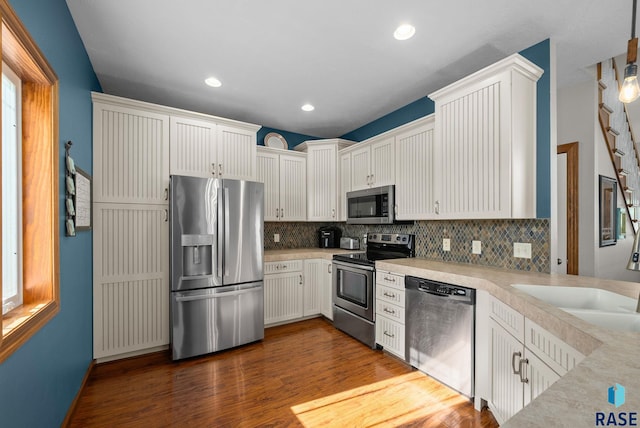 2320 N Ivy Rd, Tea, SD 57064 - kitchen with stainless steel appliances, tasteful backsplash, dark wood-type flooring, light countertops, and recessed lighting