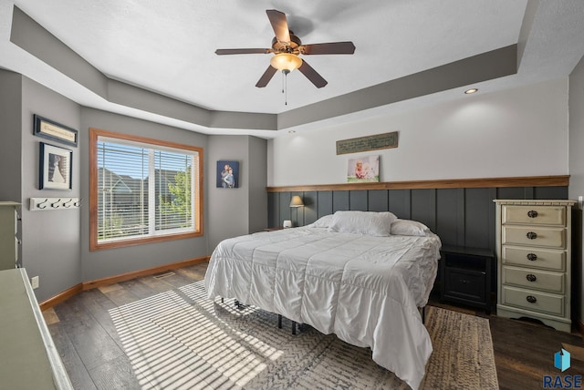 2320 N Ivy Rd, Tea, SD 57064 - bedroom featuring wood finished floors, baseboards, recessed lighting, ceiling fan, and a tray ceiling