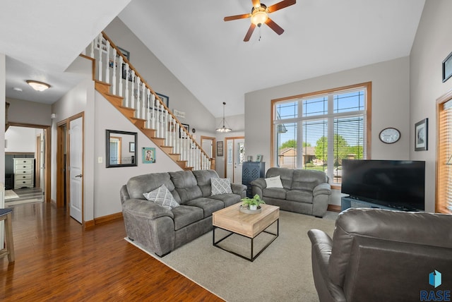 2320 N Ivy Rd, Tea, SD 57064 - living area with wood finished floors, high vaulted ceiling, ceiling fan, stairway, and baseboards