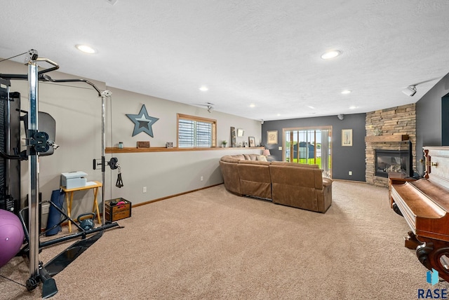 2320 N Ivy Rd, Tea, SD 57064 - carpeted living room featuring a textured ceiling, recessed lighting, a fireplace, and baseboards