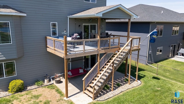 2320 N Ivy Rd, Tea, SD 57064 - rear view of house featuring a patio, a deck, a shingled roof, and stairway